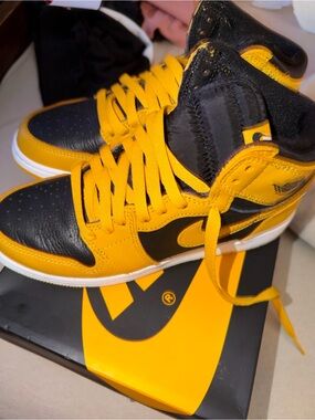 Nike Air Jordan Retro 1 High-Top Sneakers in Black and Yellow “Taxi”